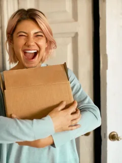 Woman happy with Subscription Box Deals.