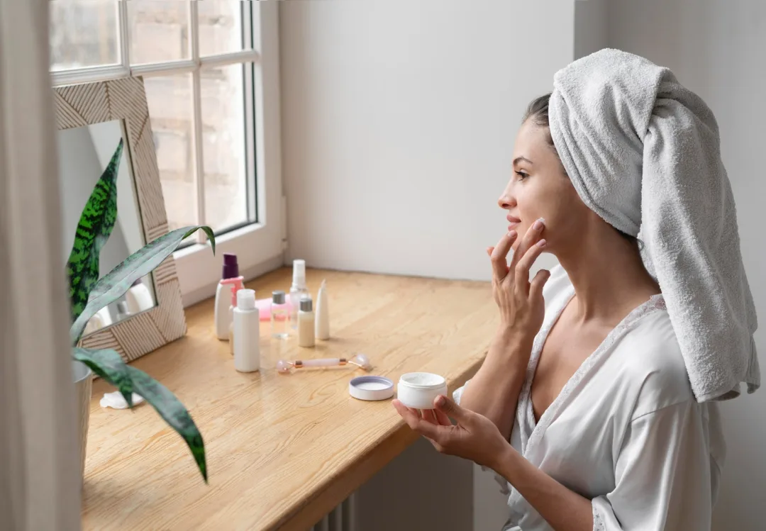 woman using skincare serums in her routine.