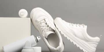 Composition with stylish footwear and shoe care accessories on g