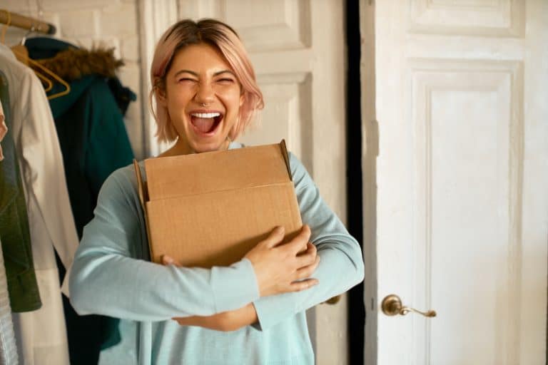 Woman happy with Subscription Box Deals.